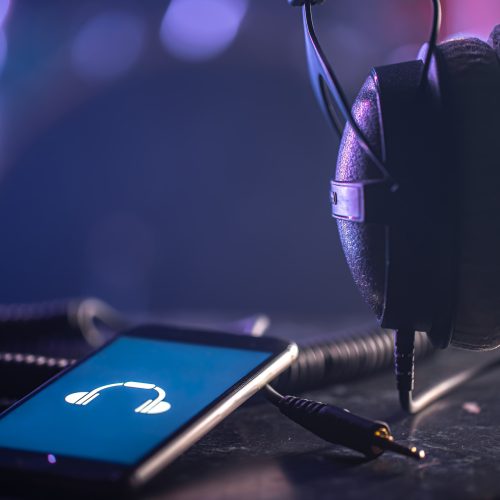 phone with music icon headphones blurred background music listening concept copy space